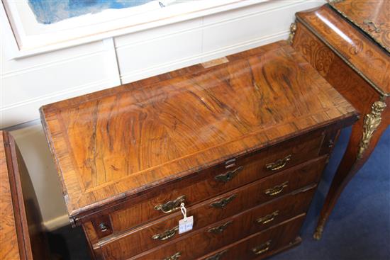 A George I featherbanded walnut bachelors chest, W.2ft 4in. D.1ft 1in. H.2ft 3in.